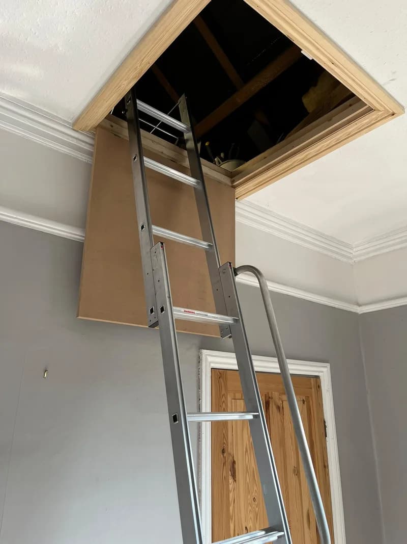 An aluminium loft ladder fitted beneath a loft opening