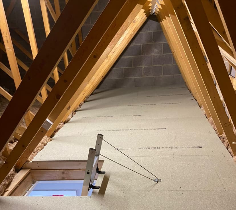 Raised loft boarding professionally installed by KMW Loft Ladders