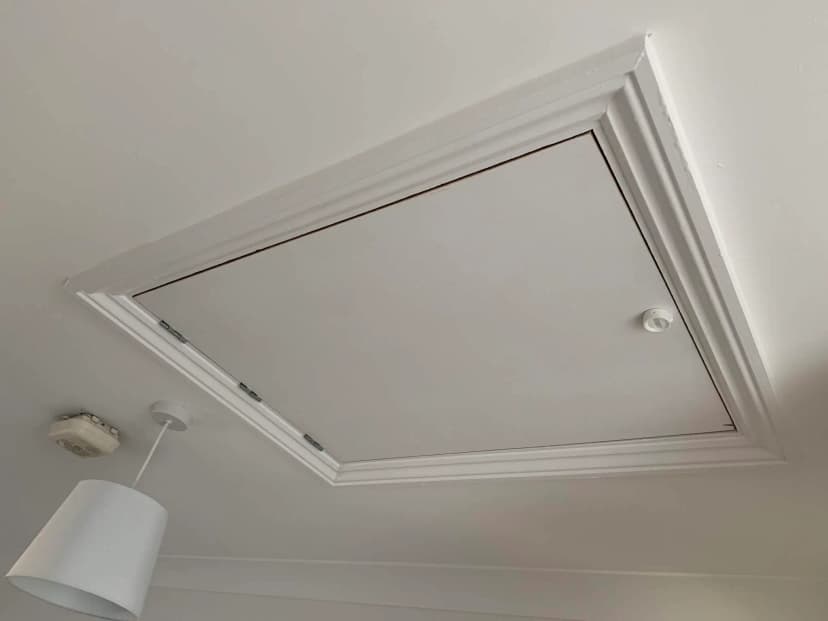 Plastic insulated loft hatch professionally installed by KMW Loft Ladders
